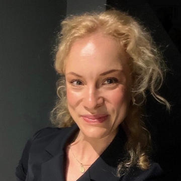 Alicja Borzyszkowska wears a dark-coloured blazer and has blonde hair.