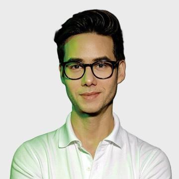 Ryan Velandria Mccarthy wears a white polo shirt and glasses. 