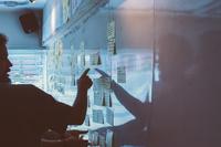 Shadow of a man pointing whiteboard information Shadow of a man pointing whiteboard information