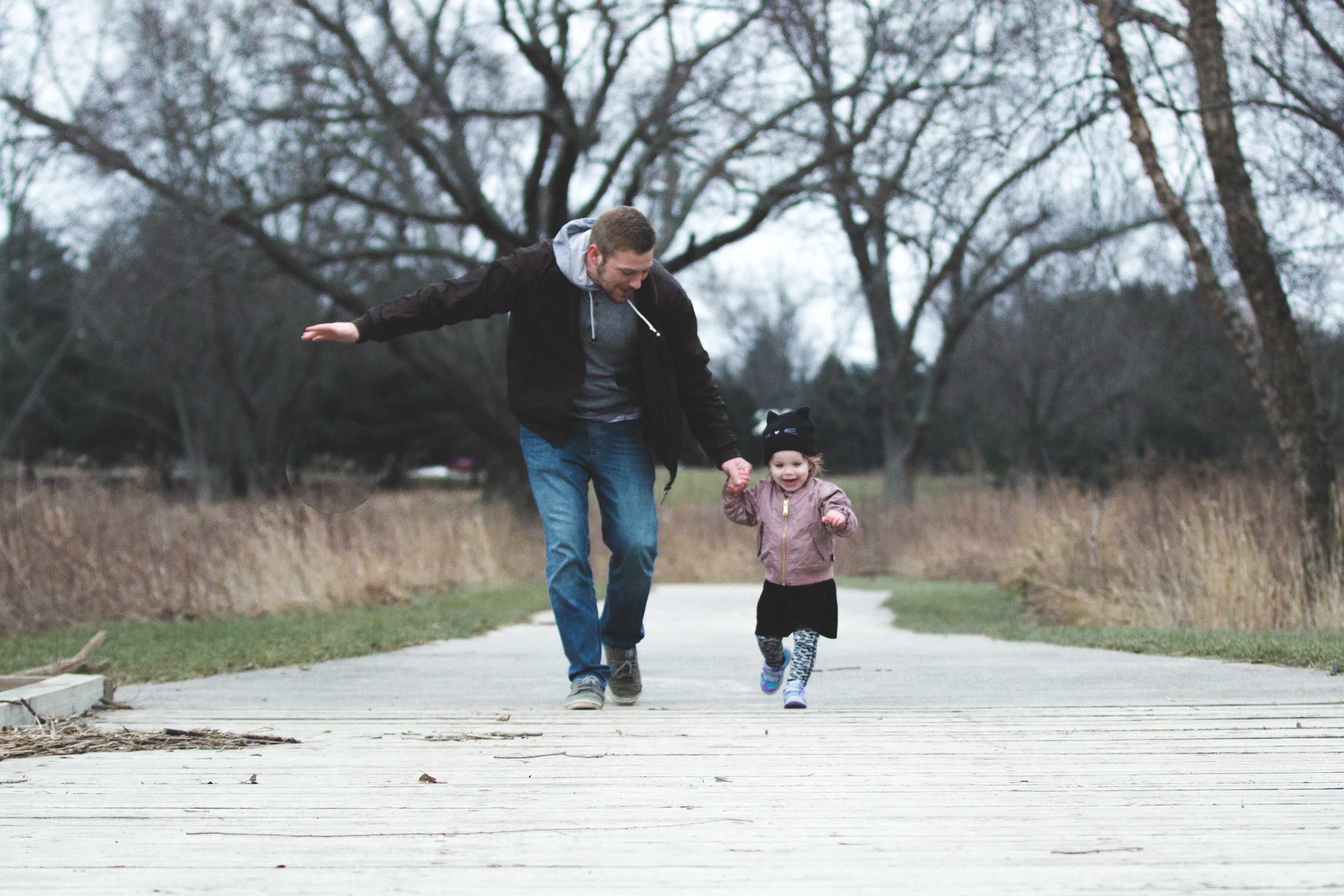 Father and daughter enjoying a walk in the park