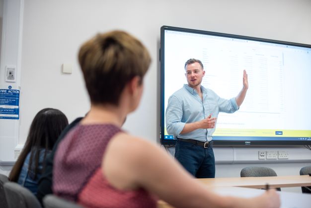 DSPI doctorate students in a lecture room