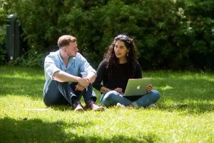 DSPI students chatting in the garden at Barnett House